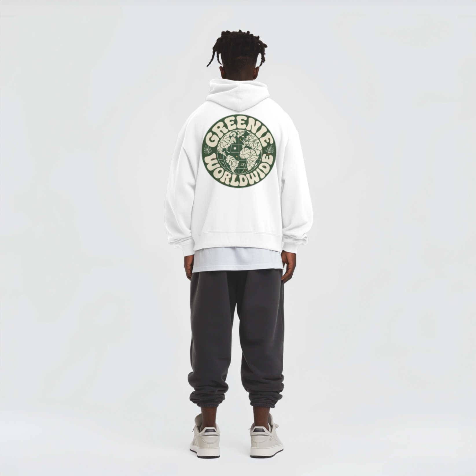 model wearing the greenie hoodie, back print visible